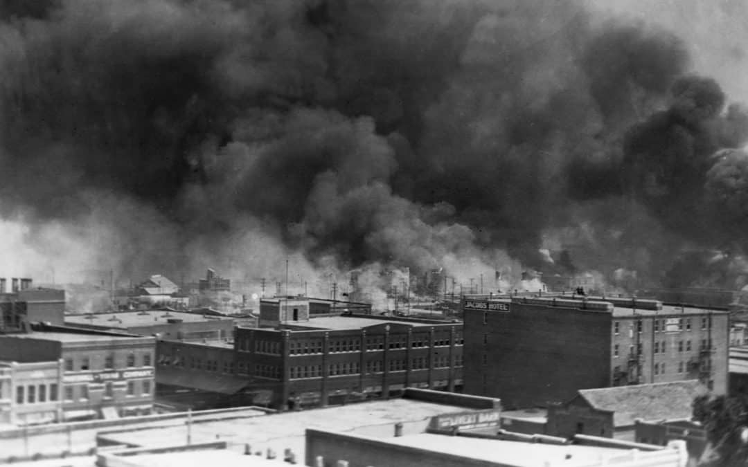 Tulsa race riots. Image of a large fire by an industrial section of Tulsa.