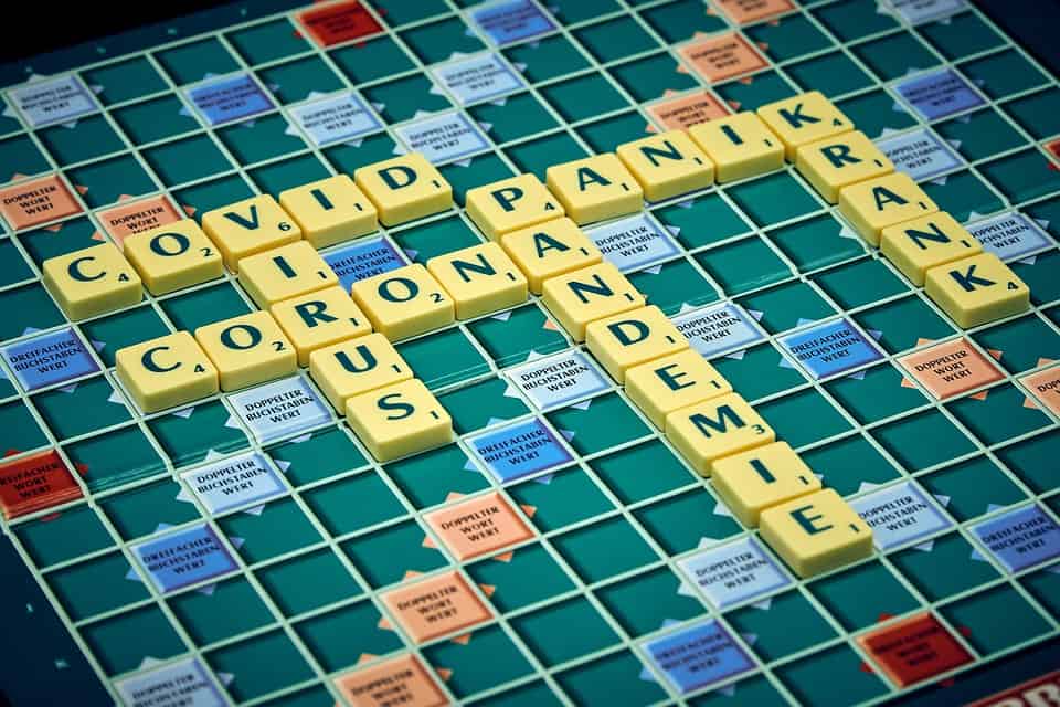a scrabble board with plagues and virus's on it.